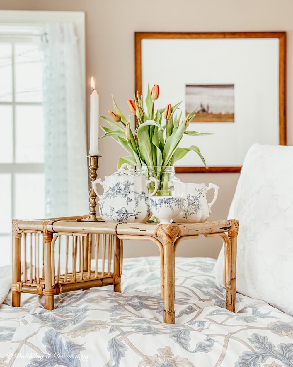 Breakfast Tray on Bed with Tulip arrangement.