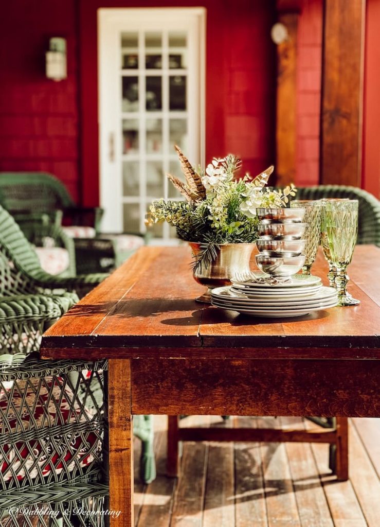 Refinished Wooden Table with Dishes, glassware, and centerpiece.