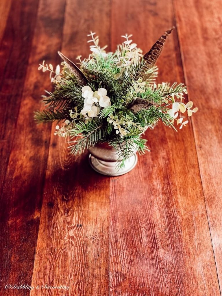 Refinished Wooden Table with Greenery Centerpiece.