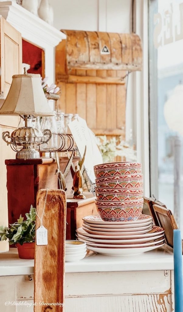 Vintage booth with dishes, lamps, and more.