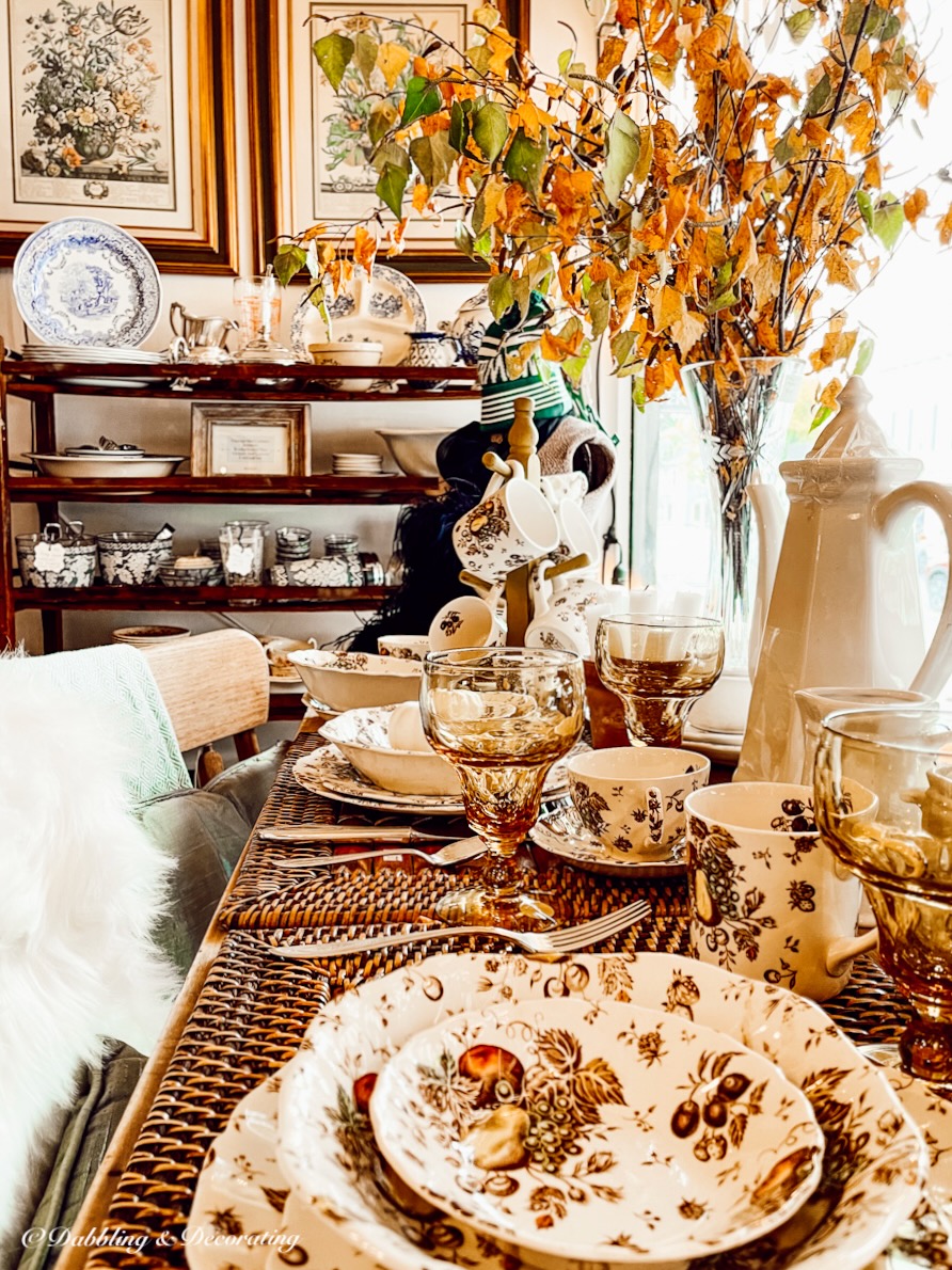 Fall table setting in vintage booth window