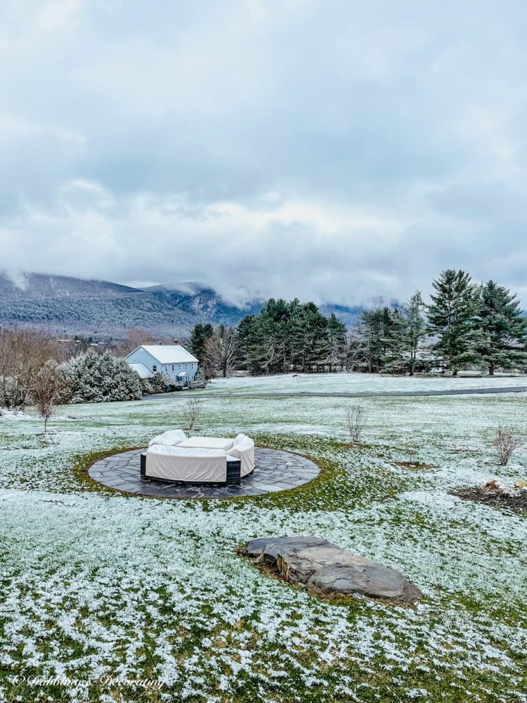 Mountain views with green grass and snow.