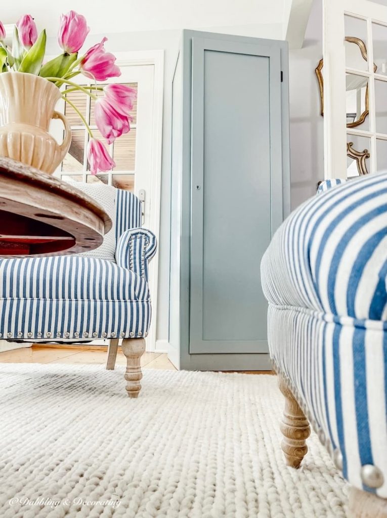 Blue Wardrobe Closet and blue chairs and pink tulips