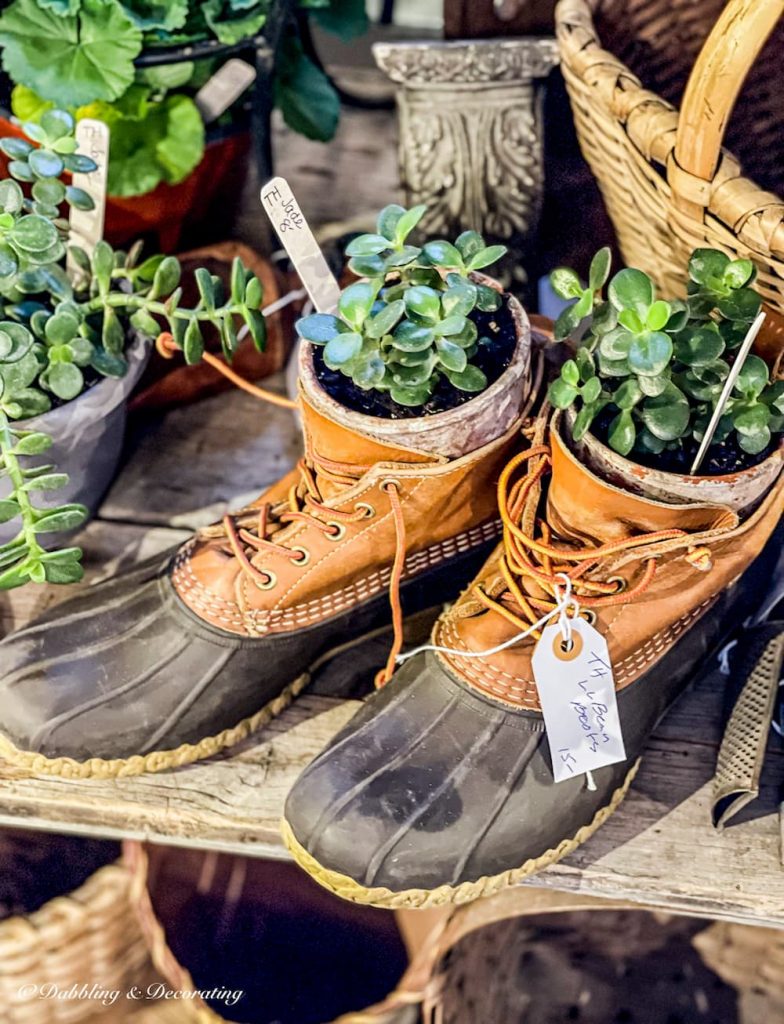LL Bean Boots with herbs planted in them for a fun twist on front porch flower planters.