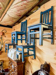 Blue Chairs hanging on the wall.