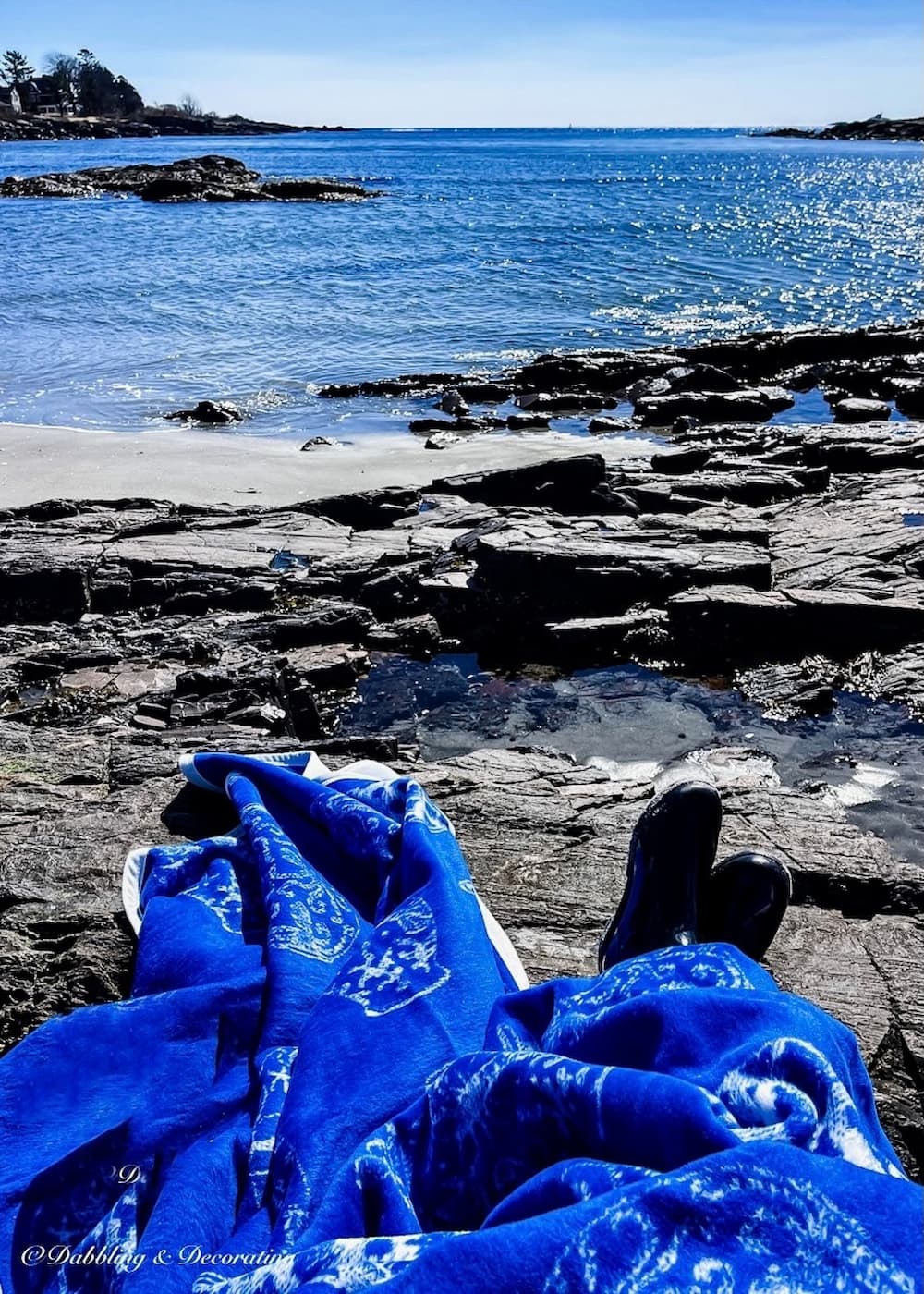 Chappy Wrap blanket and wellie boots on rocky Maine coast