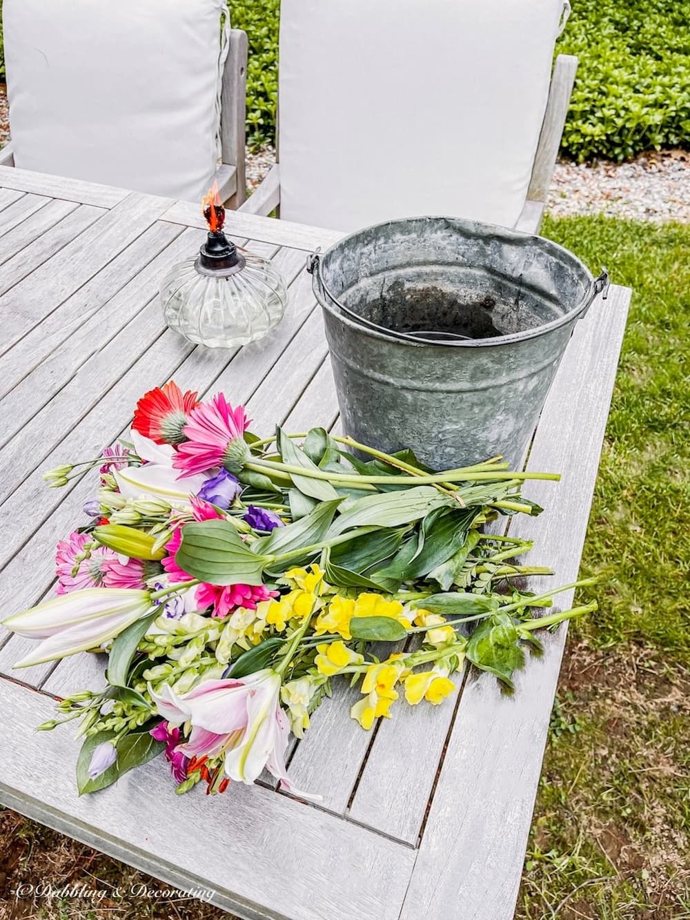 Bucket on Table with Flowers