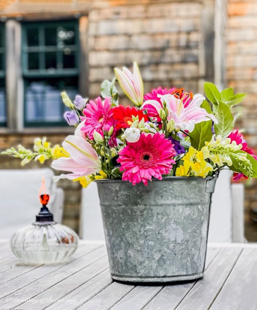 galvanized flower bucket with gorgeous spring bouquet.