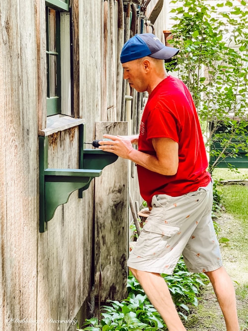 Man Drilling into Wall