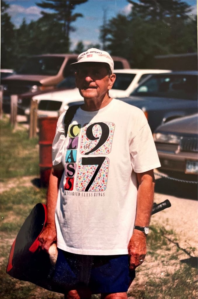 Father ready to play tennis.