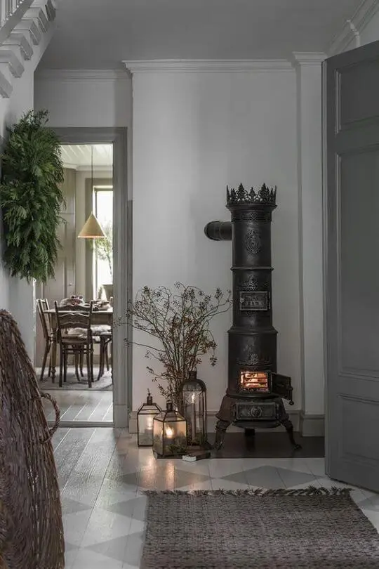 Vintage Scandinavian cottage black stove in hygge home.