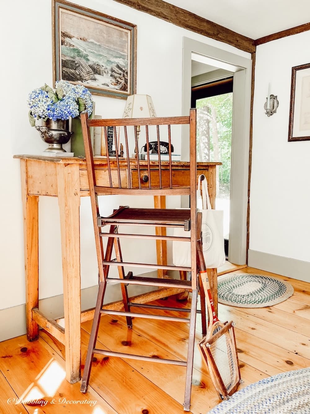 Vintage tennis umpire chair at tall desk, a gift from Maine.