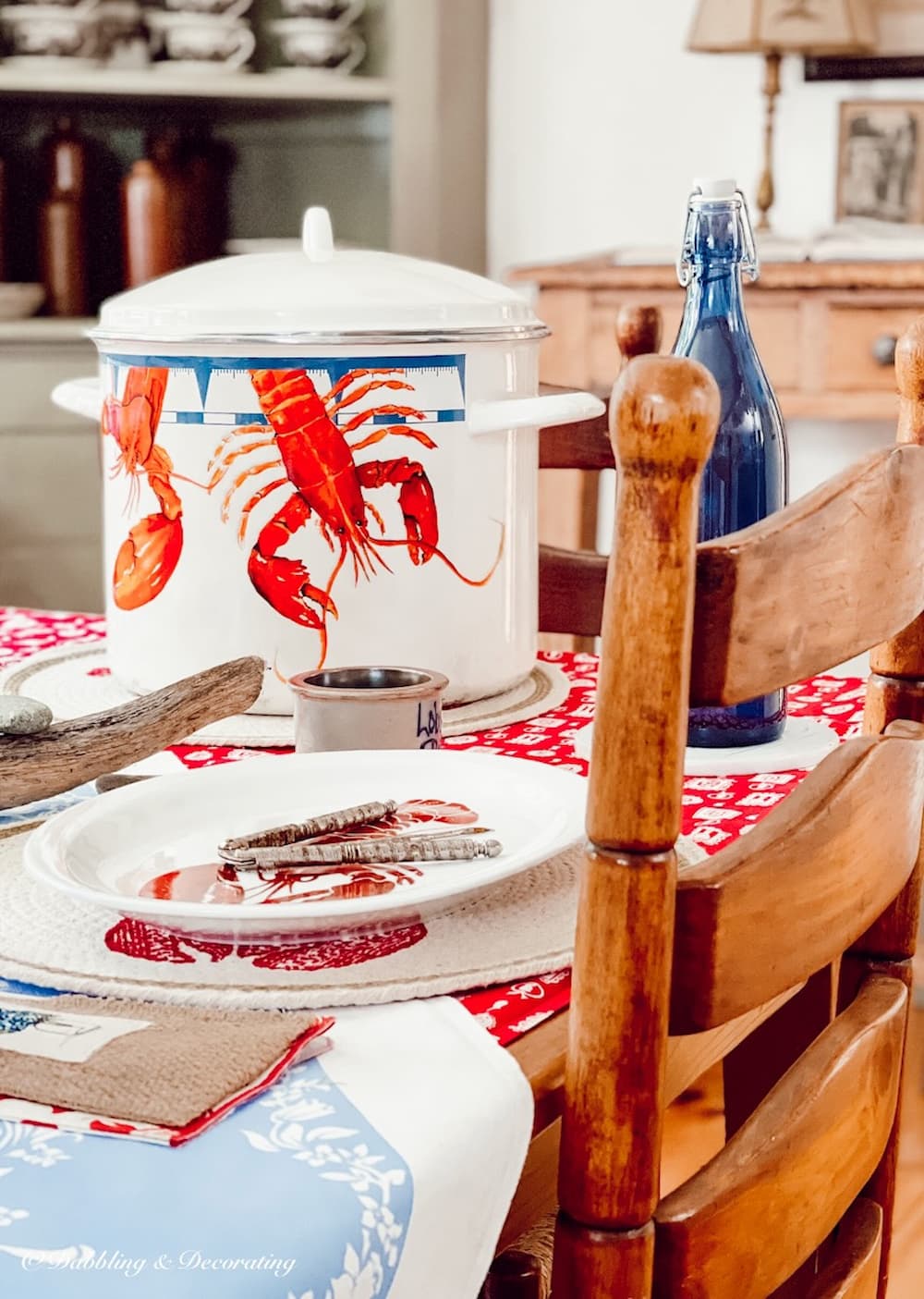 lobster decor from Amazon, large pot on coastal table setting.