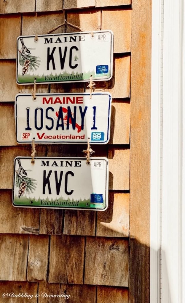 License Plate DIY Wall Decor on Outdoor Cedar Shake Siding.