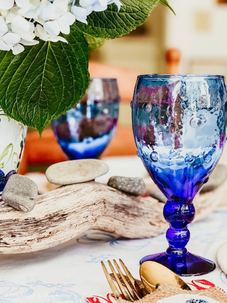 Blue glassware on lobster decor table.