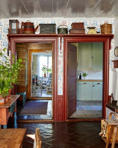 Scandinavian cottage interior with two doorways and vintage details