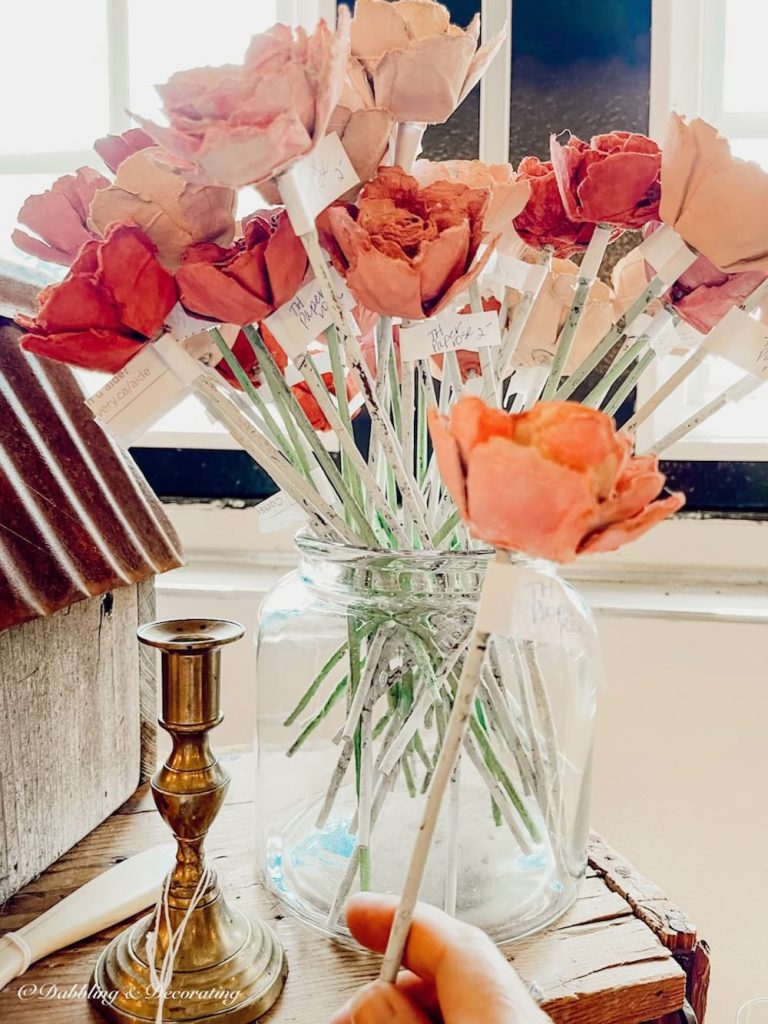 Vintage pink McCoy vase at Sage Farm Antiques with pink handcrafted flowers.