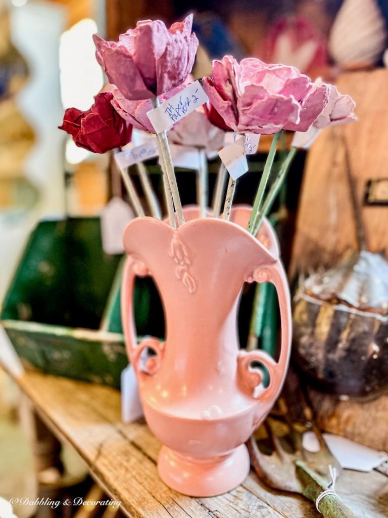 Glass jar filled with pink hand crafted flowers at Sage Farm Antiques.