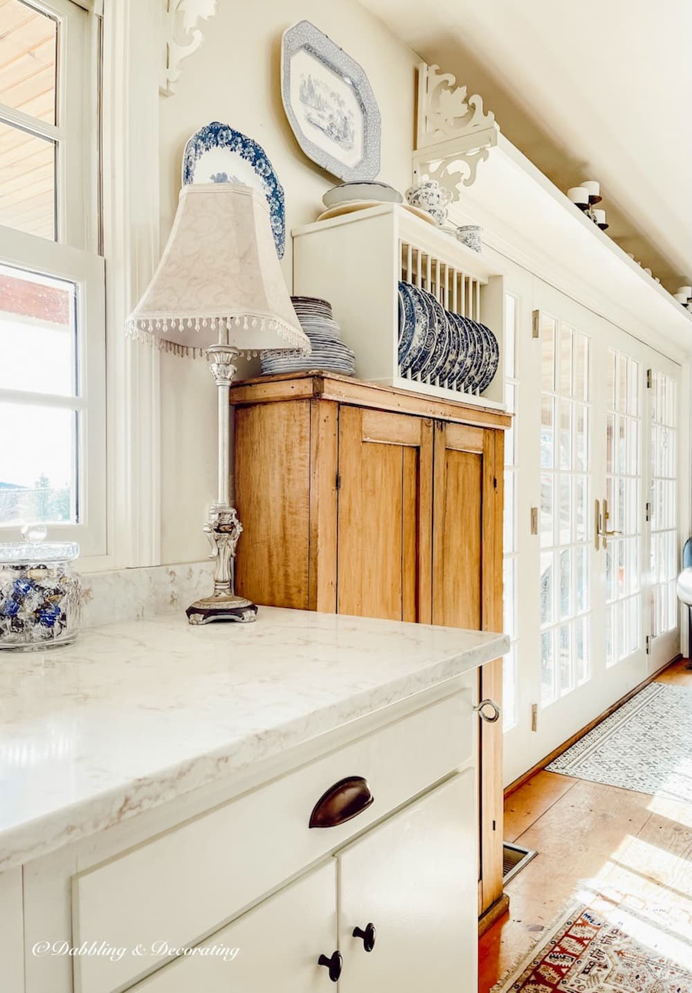 Farmhouse Cabinet in open farmhouse white kitchen with vintage style.