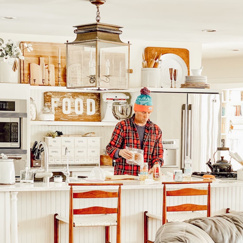 Man in White Farmhouse Kitchen