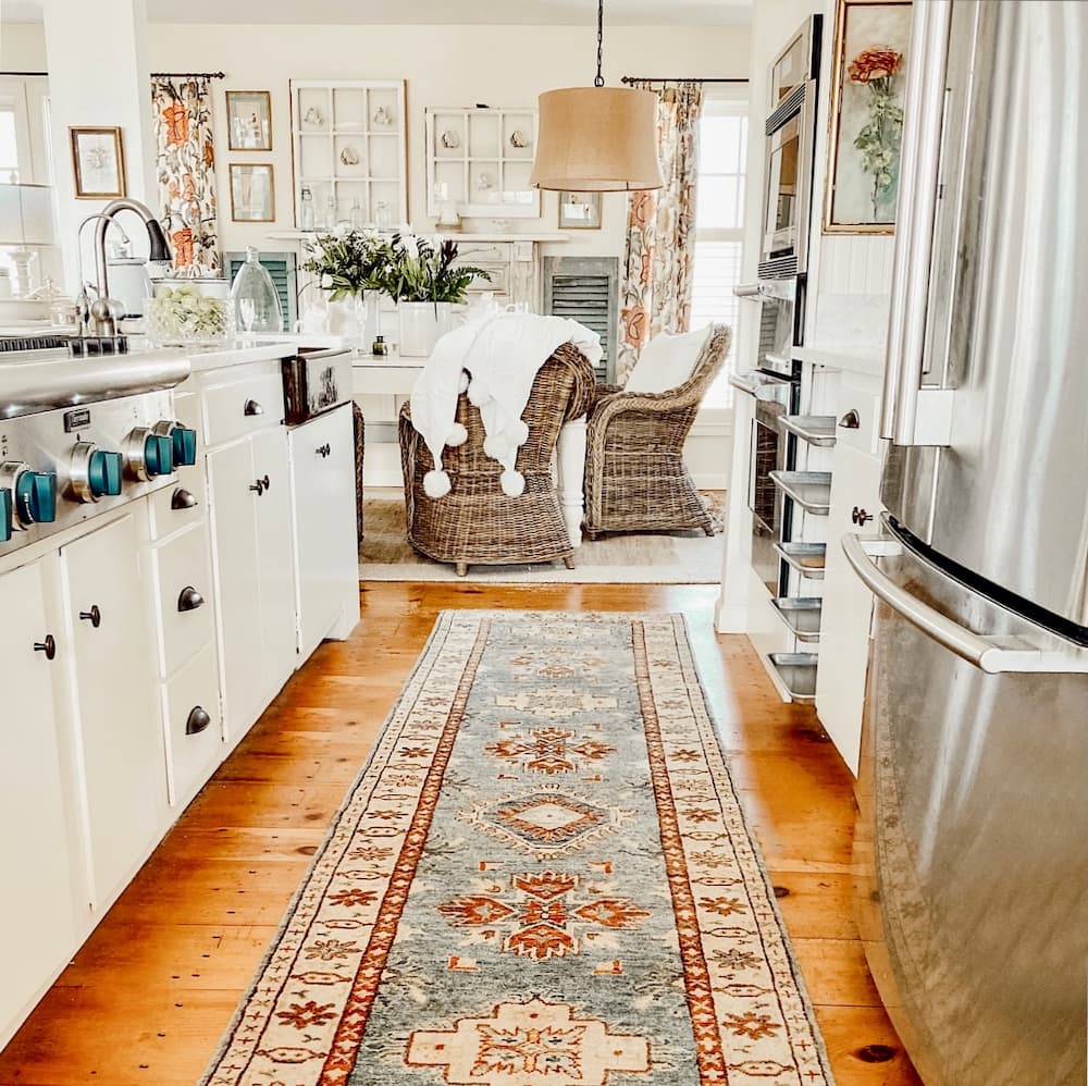 Open Farmhouse white kitchen with attached dining room.