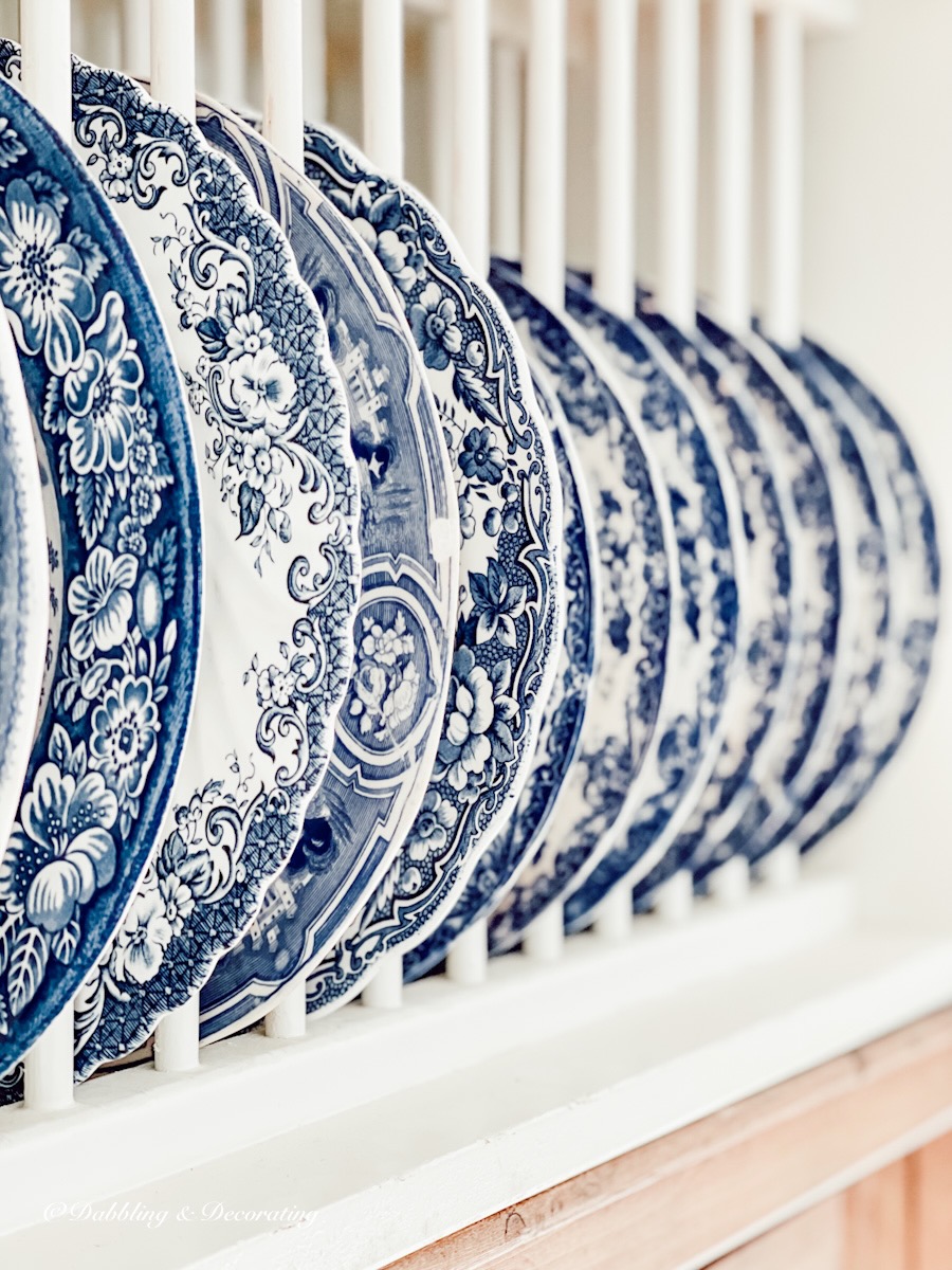 Blue and White Dishes in vintage kitchen dish rack.