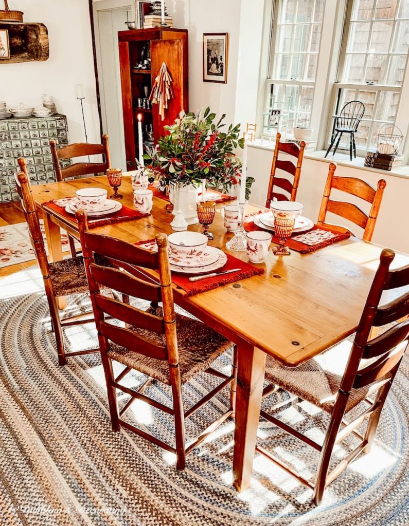 The Finest Winter Wonderland Dinnerware Set displayed for the holidays in colonial style dining room.