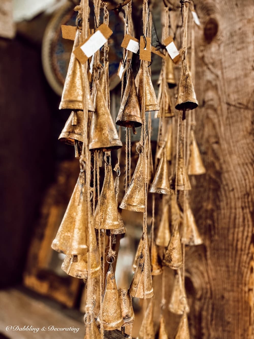 Vintage Brass Bells hanging in an antique store.