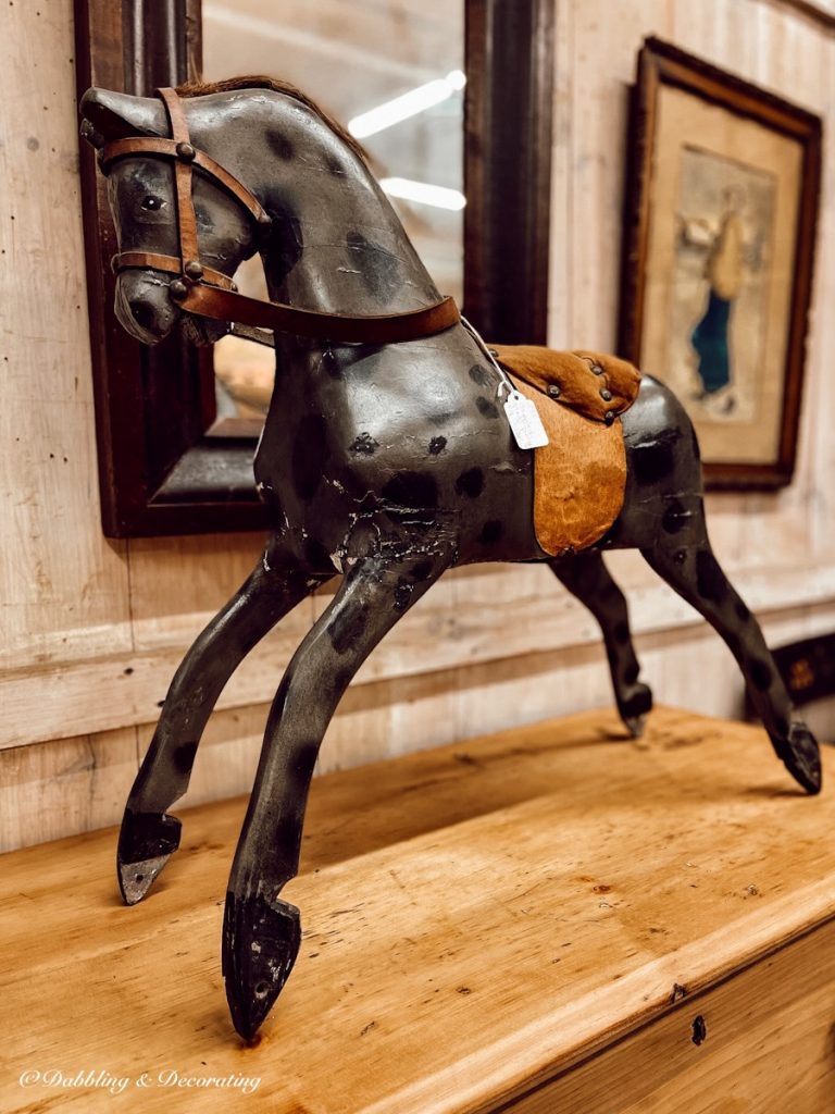 Antique black horse in antique store.