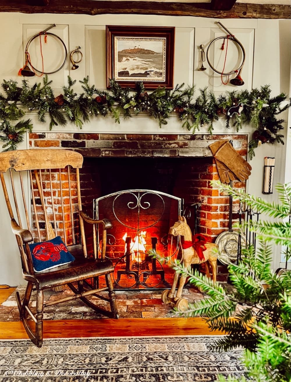 Colonial Christmas Decorations surrounding Early American fireplace for the holidays with modern touches.