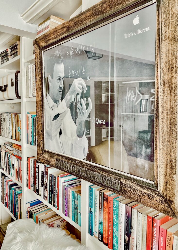 Vintage framed print on bookcases with books