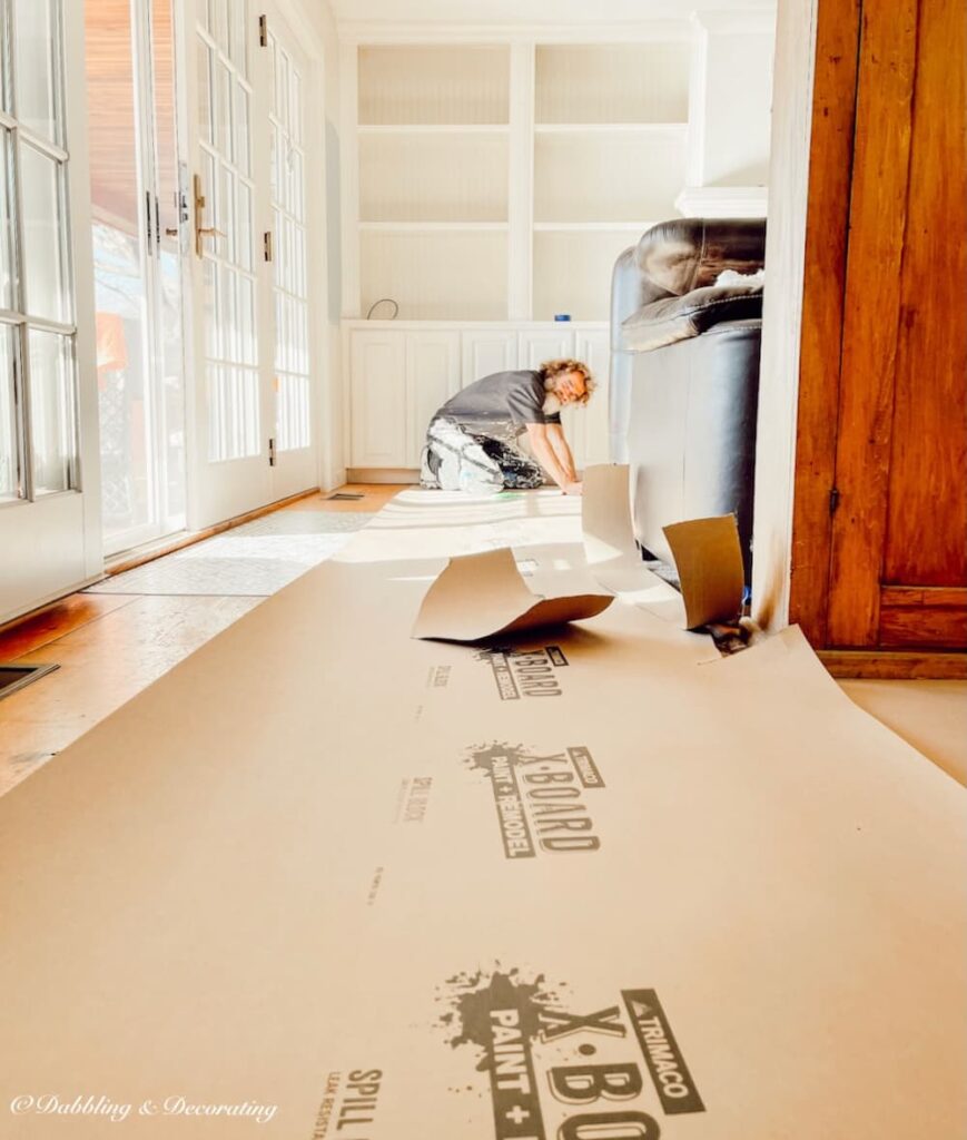 Painter Prepping Floors