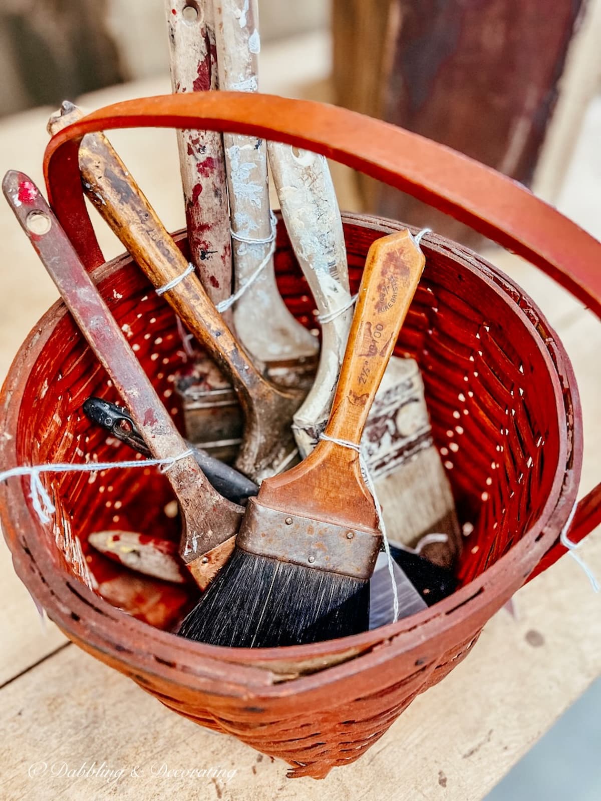Red Basket with vintage paint brushes