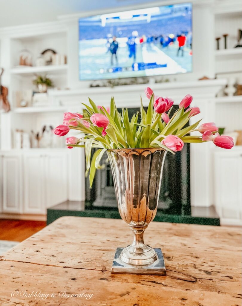 Vintage Silver Vase on coffee table with pink tulips