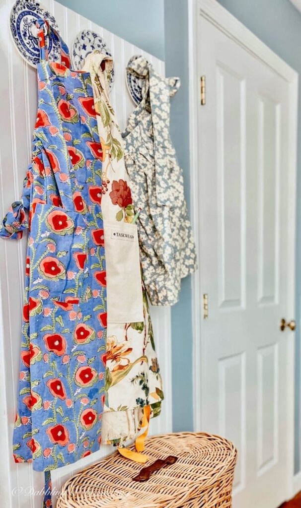 DIY wood wall hooks you can DIY in minutes with Aprons on wall.