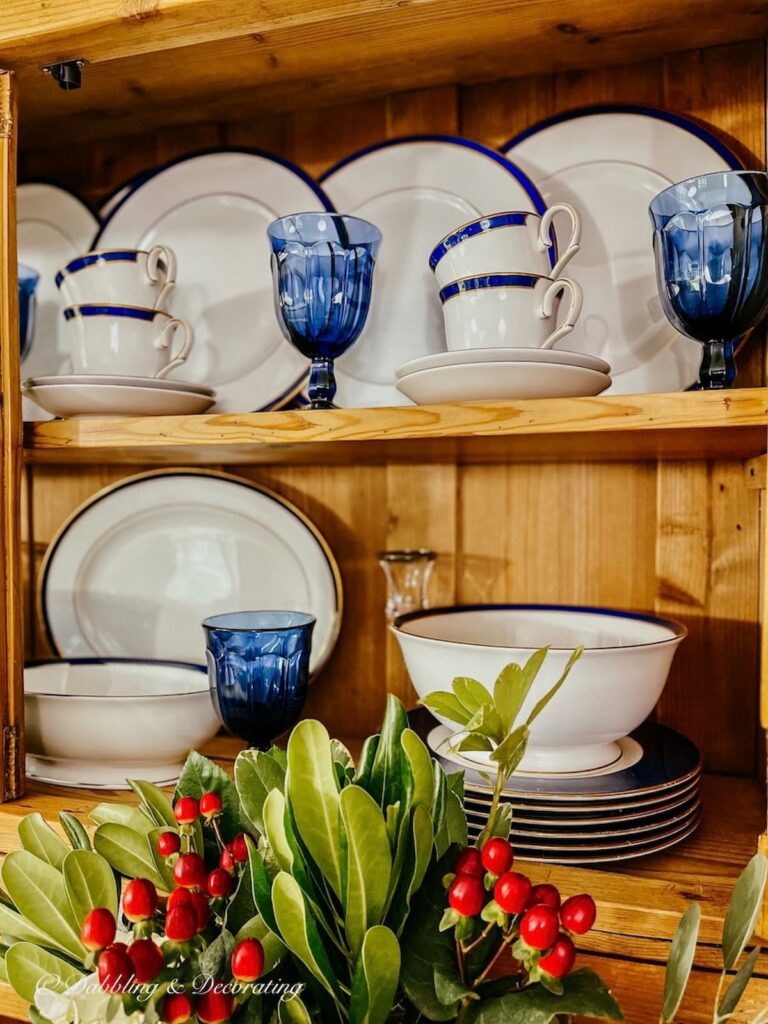 blue and white china display in vintage china hutch.