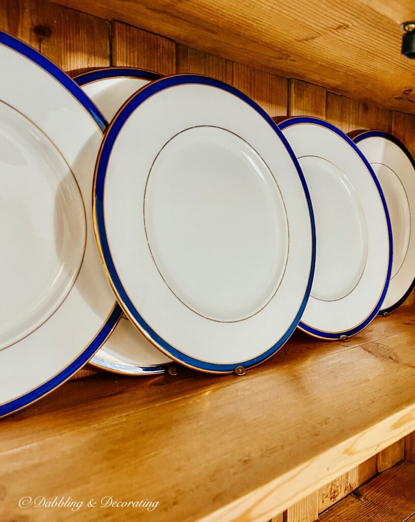 China Plates with Thumbtacks in Vintage China Hutch