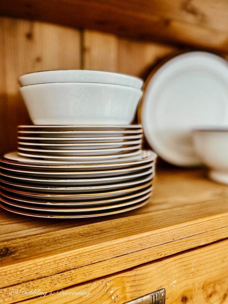 stacked china plates and bowls.