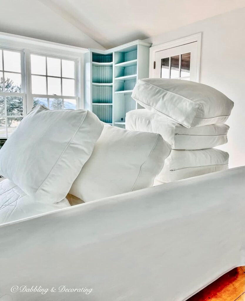 Benjamin Moore Sunroom Paint Colors That Work, Our Wedgewood Gray Makeover wit white sectional couch and Chantilly Lace white walls