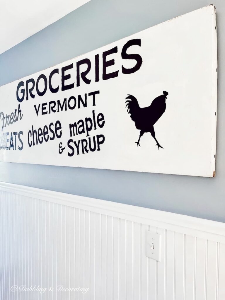 Sherwin Williams Stardew on walls in home's entryway with large white farmhouse sign.