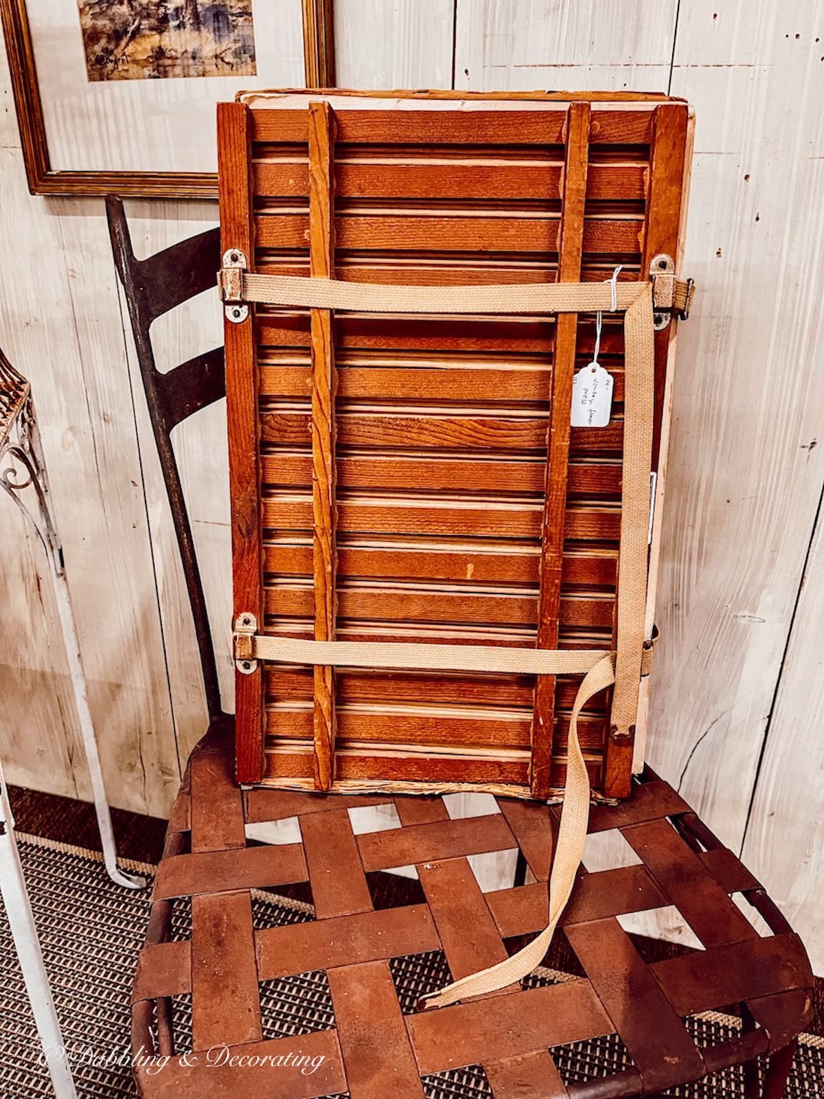 Vintage Flower Press sitting on a chair at Stone House Antique Center in Chester, Vermont.
