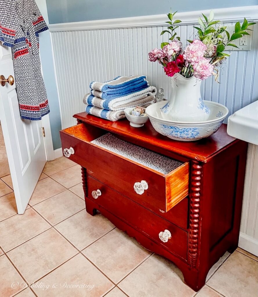 A Petite Antique Dresser in the Bathroom