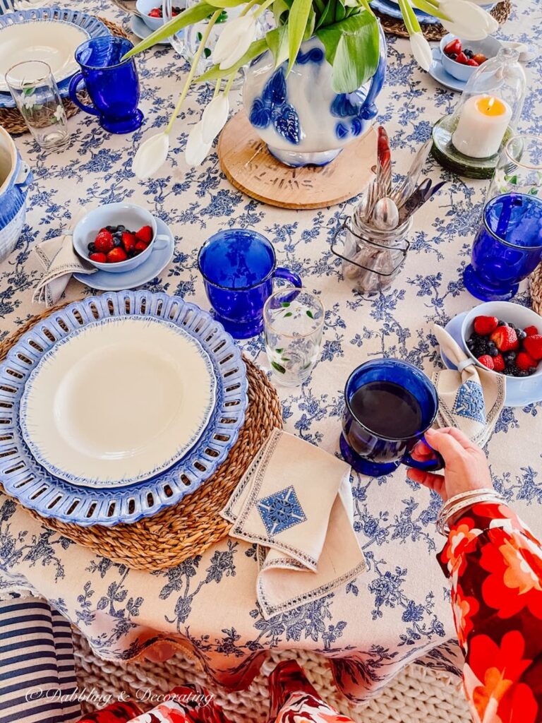 Breakfast table decorated in blue and white fall decor.