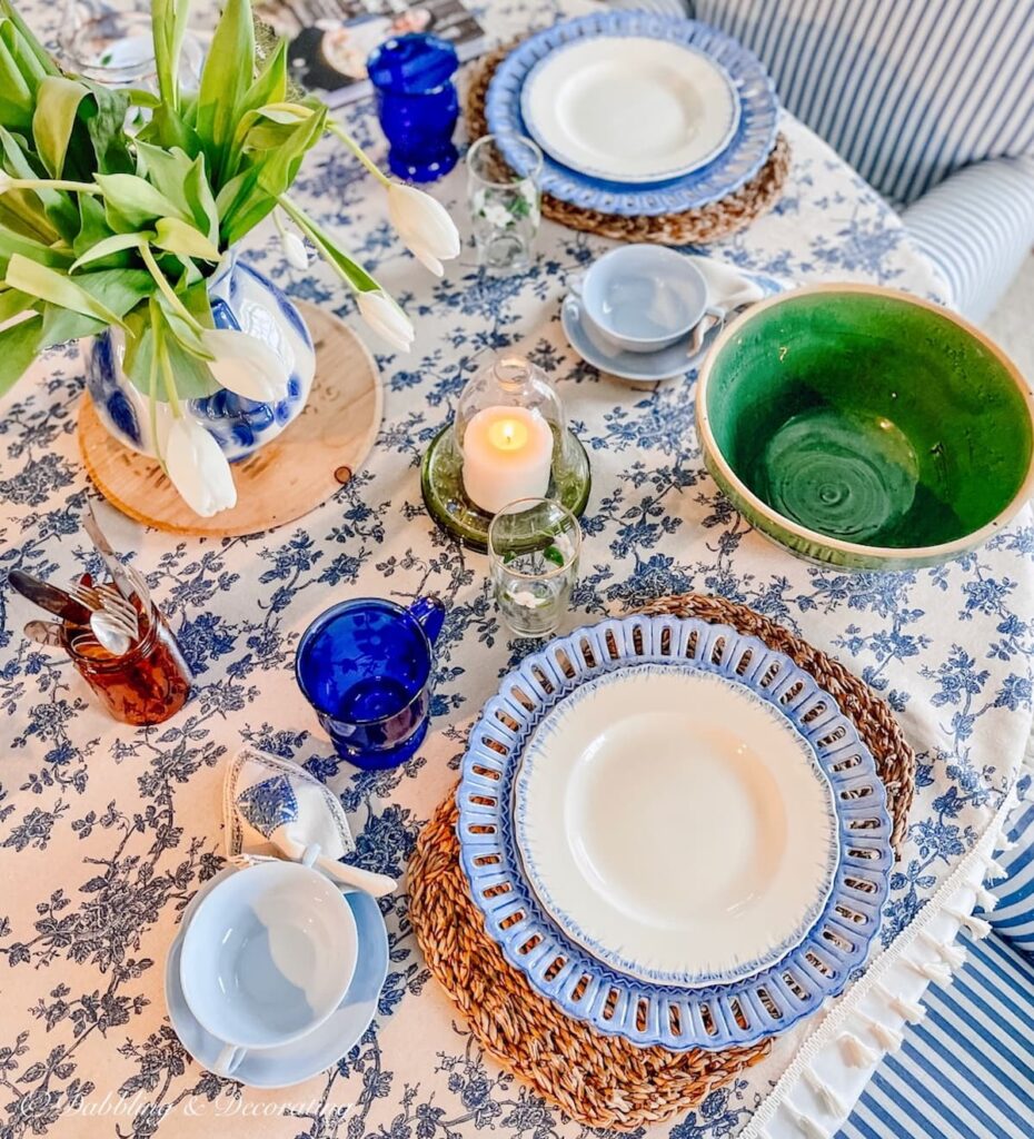 Breakfast Nook ideas with blue and white vintage table details and layered linens.
