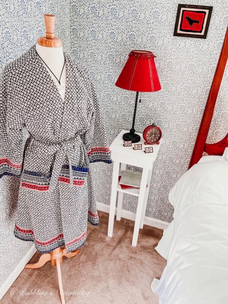 Dress Form Mannequin in Bedroom with Bathrobe in blue and red.