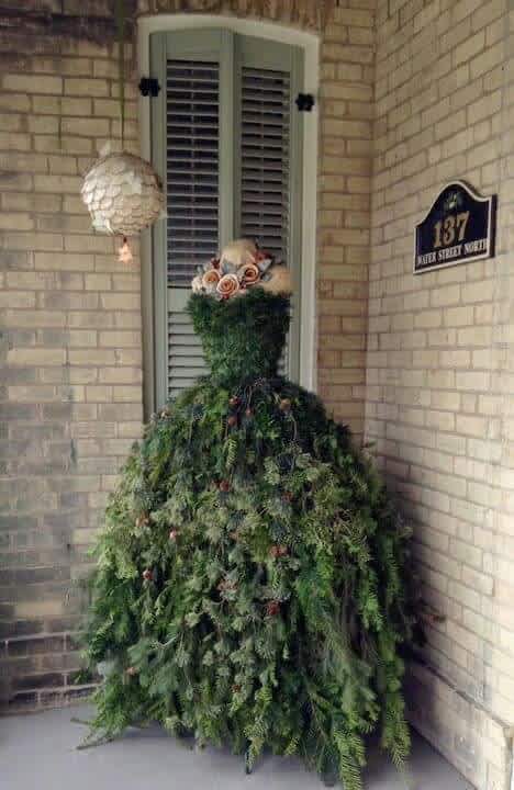 She Attaches Tree Branches To The Old Dress Form.