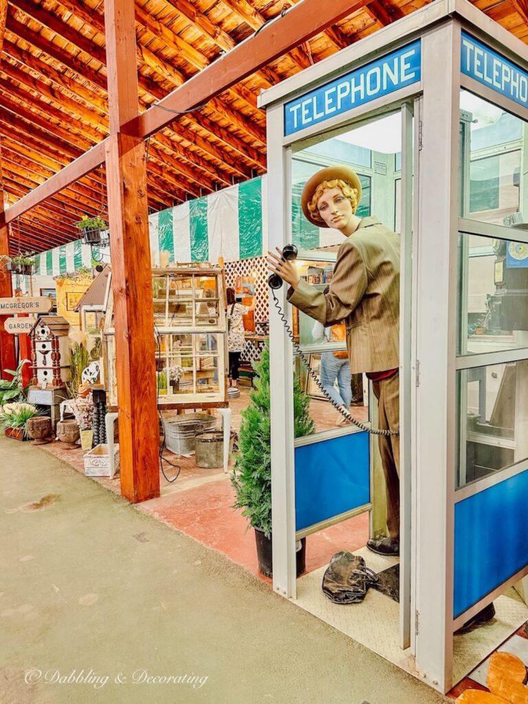 Vintage Mannequin in a Telephone Booth