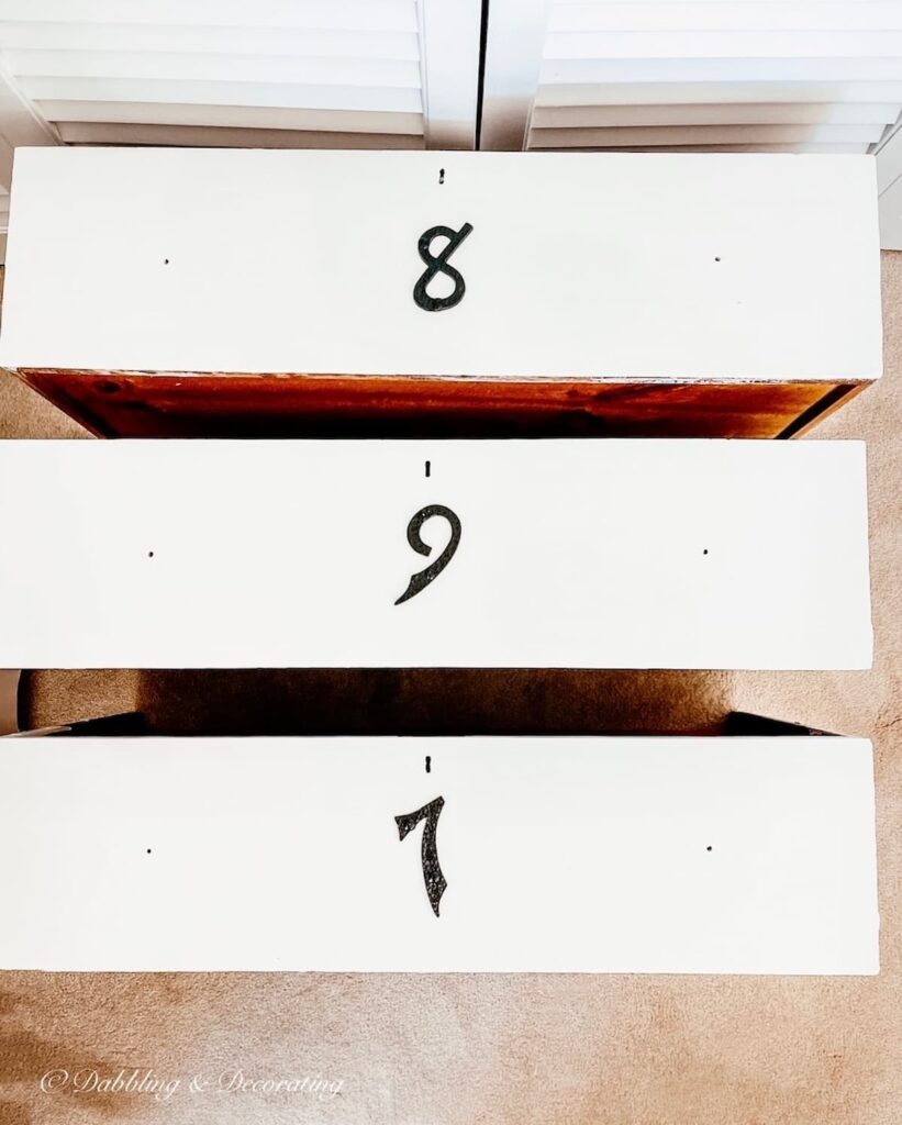 painted dresser drawers with wrought iron house numbers