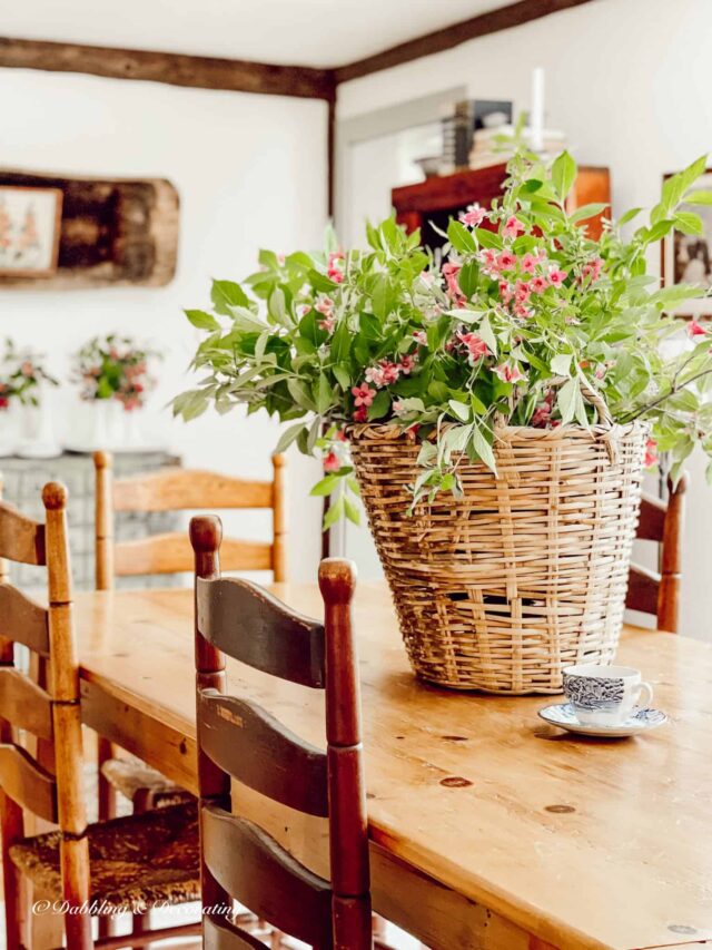 Wildflower arrangement in basket on table centerpiece.