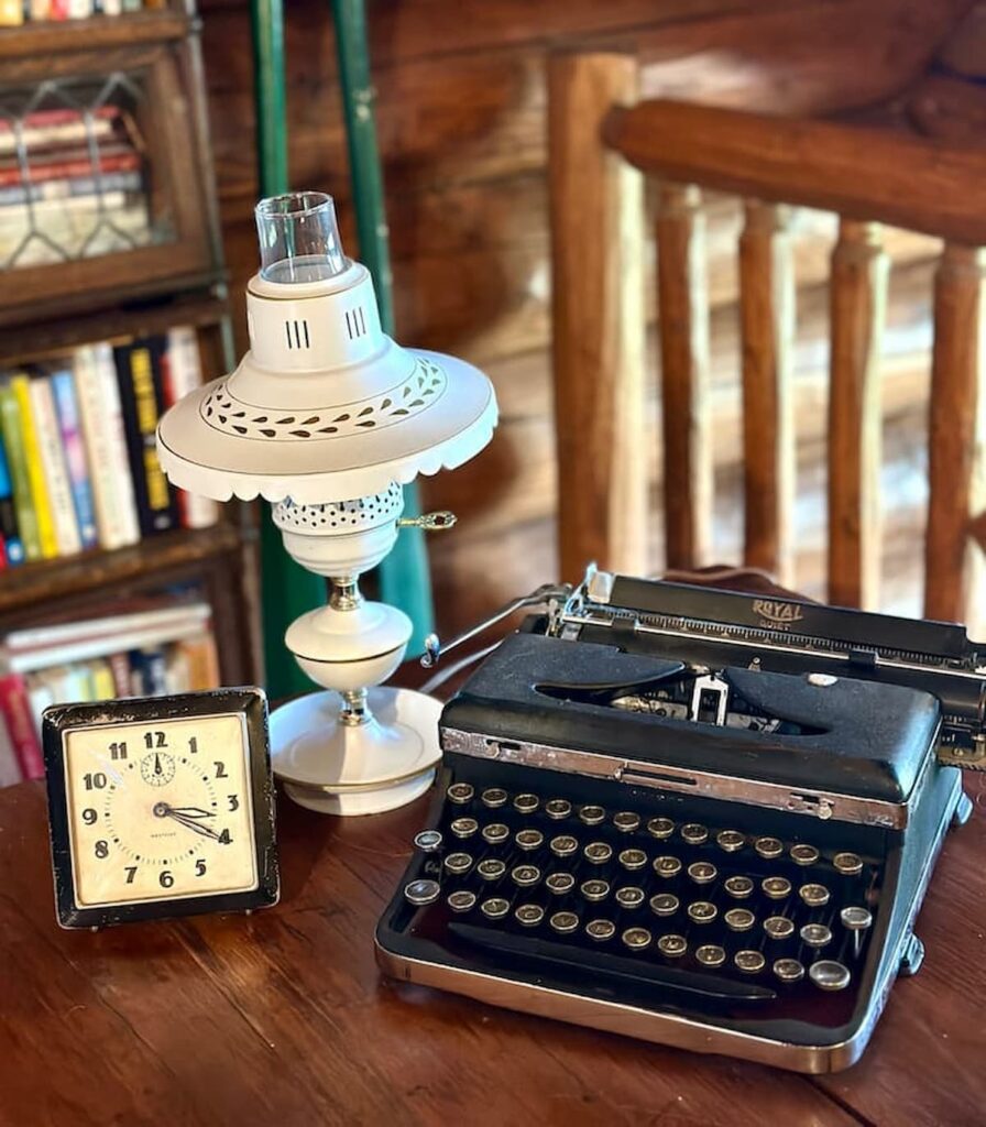 Vintage Typewriter and Clock on Table